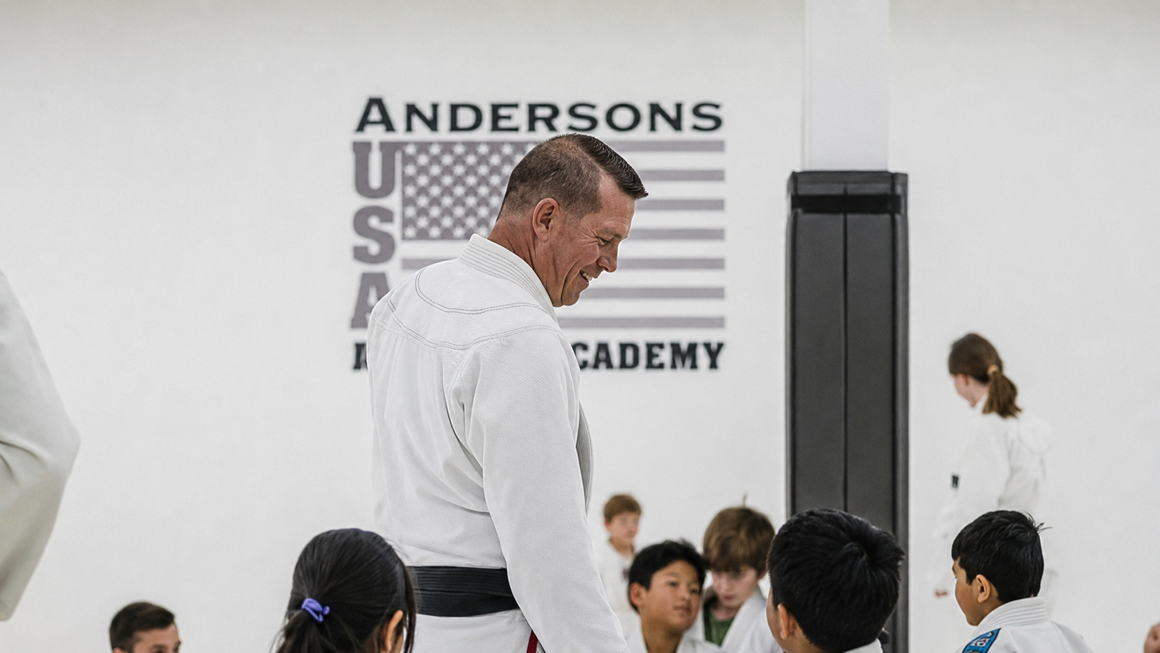 Lee Anderson, founder and head coach at API, in his white gi with black belt at Anderson's USA Jiu-Jitsu Academy